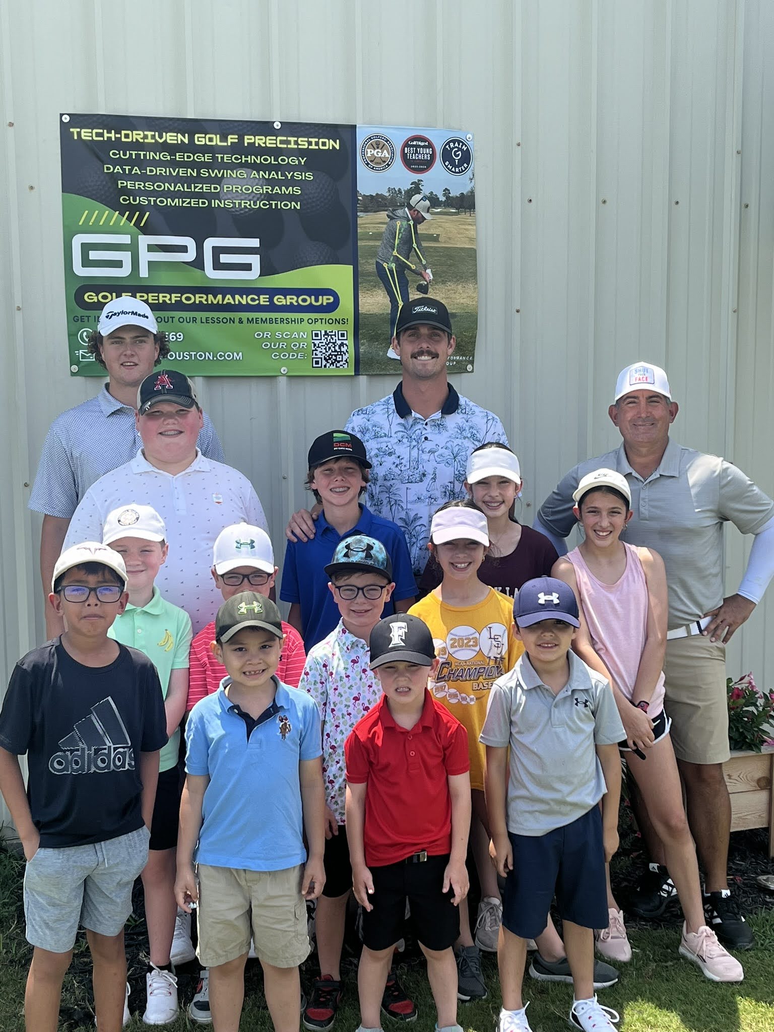 Junior golfers with Golf Performance Group coaches at an academy event