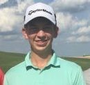 Logan P. on a golf course wearing a cap and polo